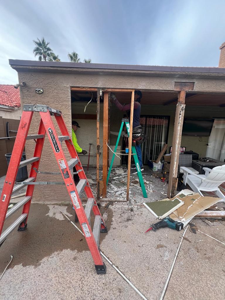 Crew working on a covered patio demolition