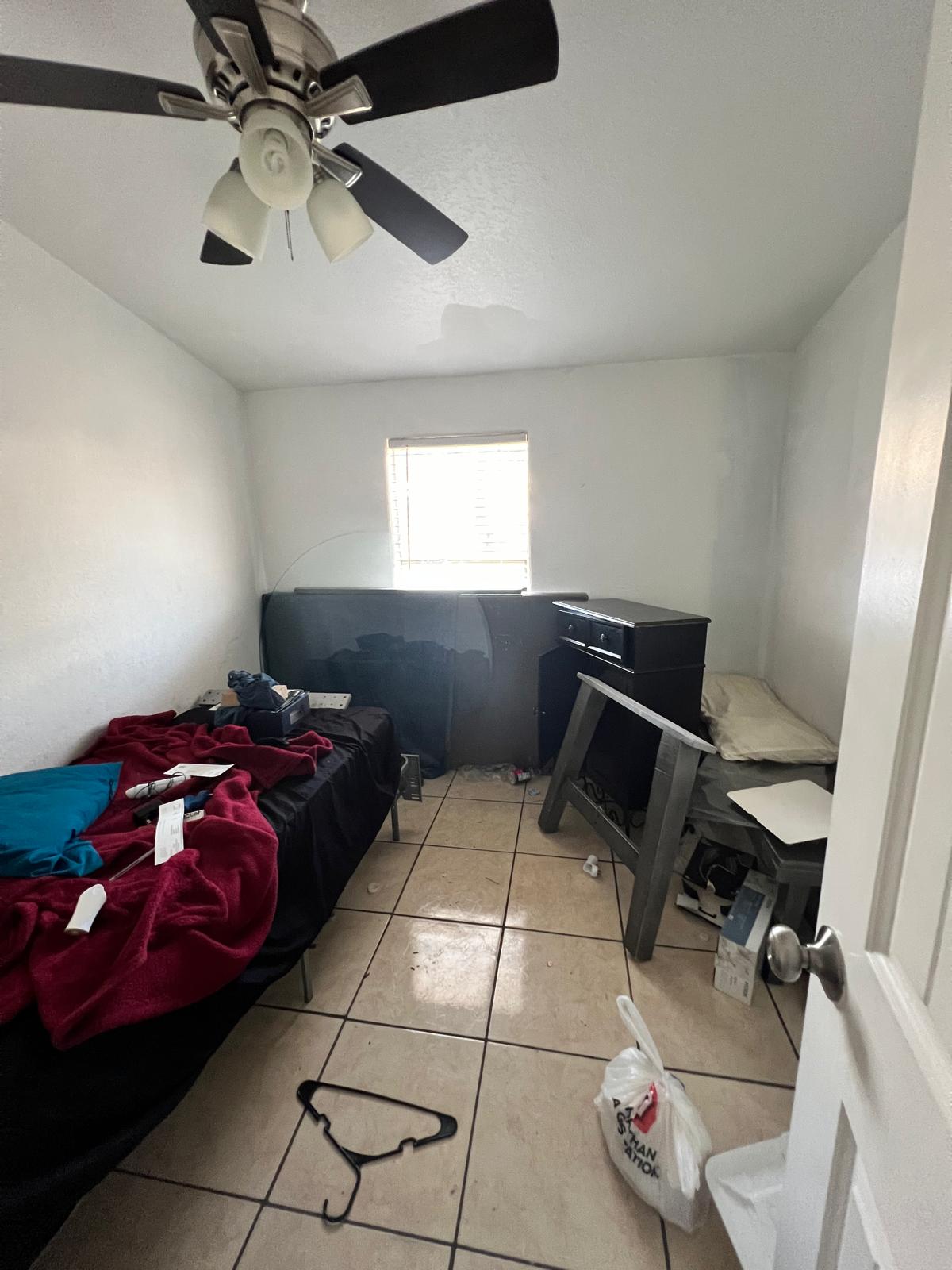 Room with furniture and items before cleanout