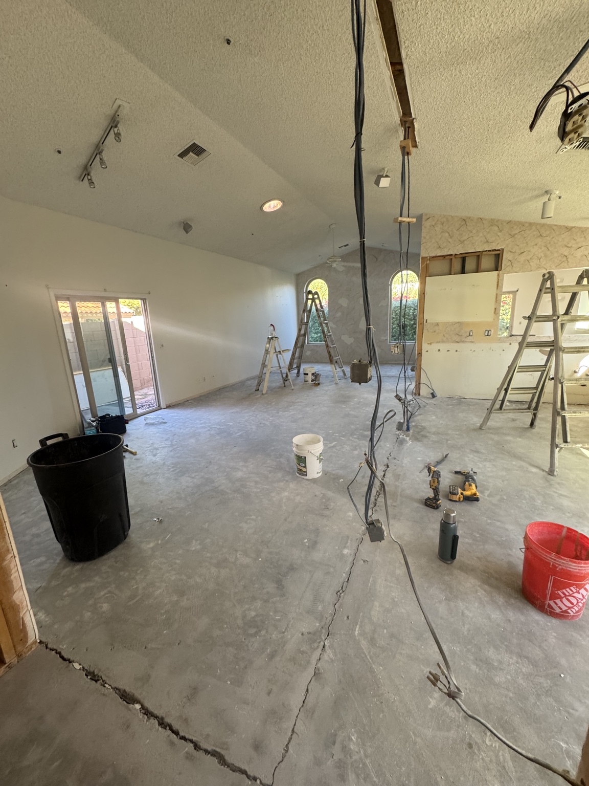 Concrete subfloor exposed after tile removal during renovation